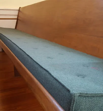 Custom church pew cushions installed on wooden pews