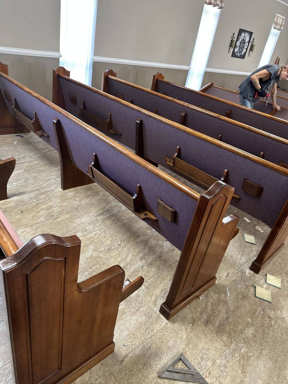 Sanctuary makeover with restored and reupholstered church pews