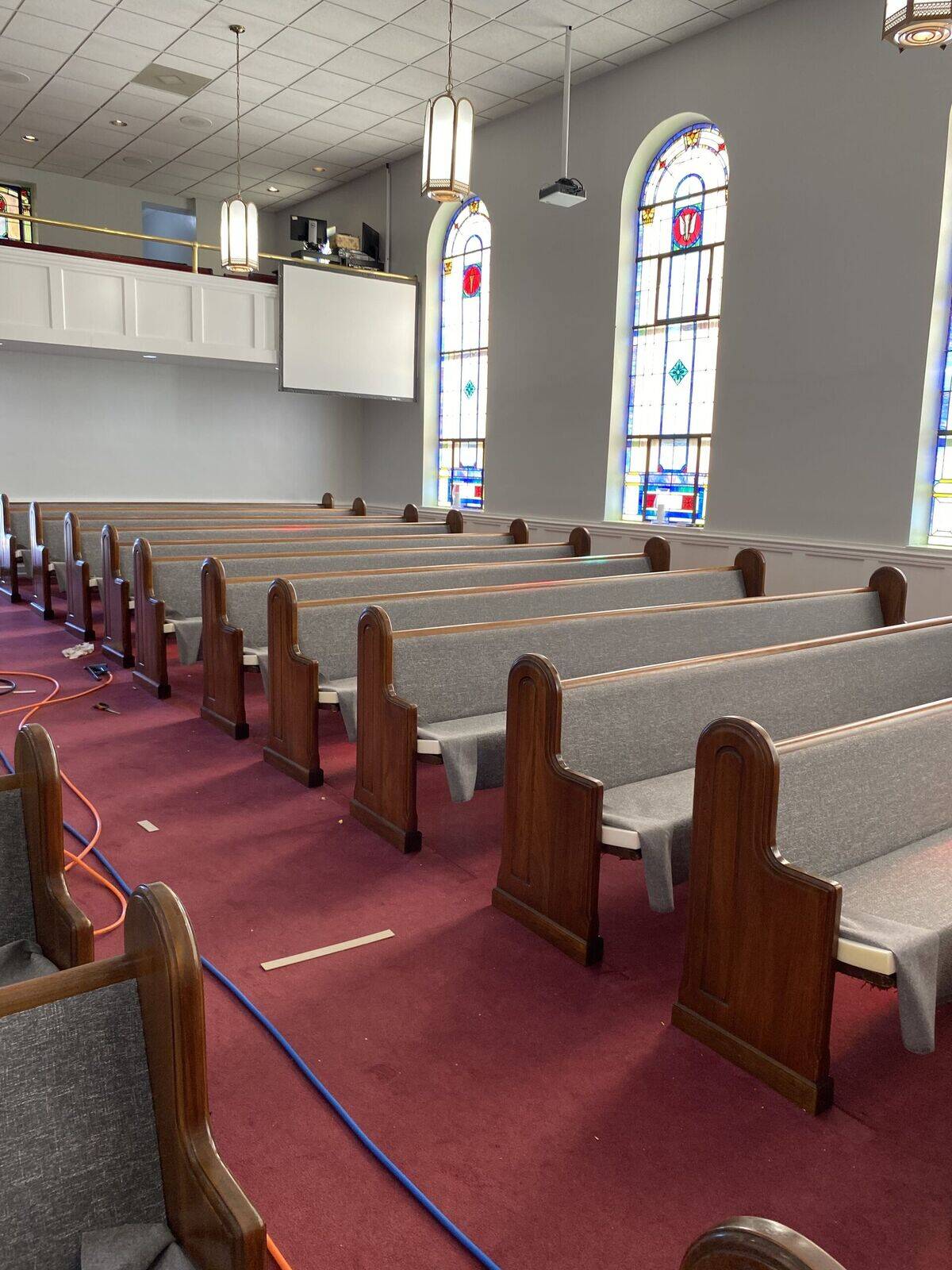 Pews recovered in gray fabric, Cherryville, NC