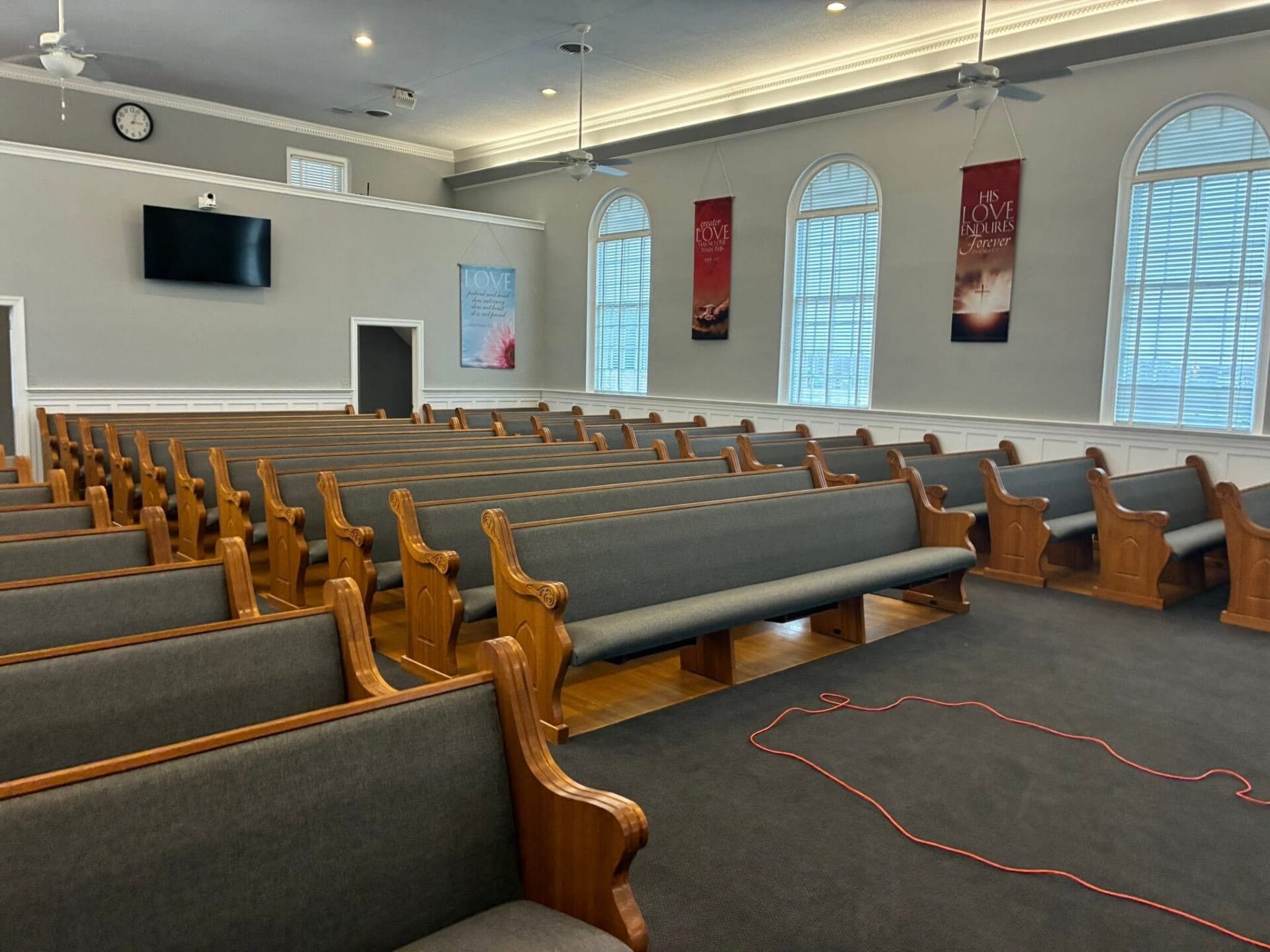 Church pew upholstery before and after at Zoan Baptist Church: new gray fabric and foam
